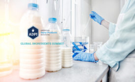three bottles of milk and lab workers