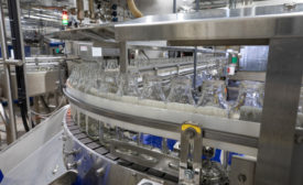 O-AT-KA bottles on conveyor