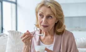 Woman Eating Yogurt